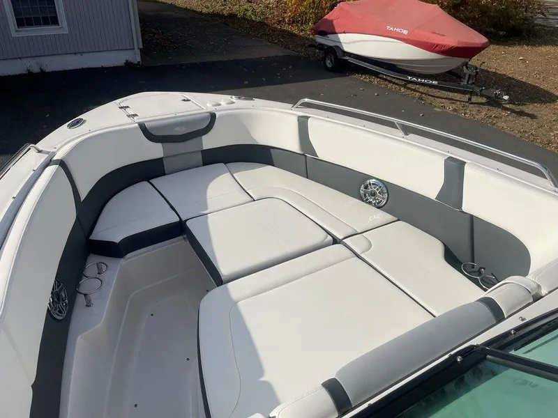 Slide: The Image of 2024 Chaparral 280 OSX boat interior with spacious seating and modern design. - 11