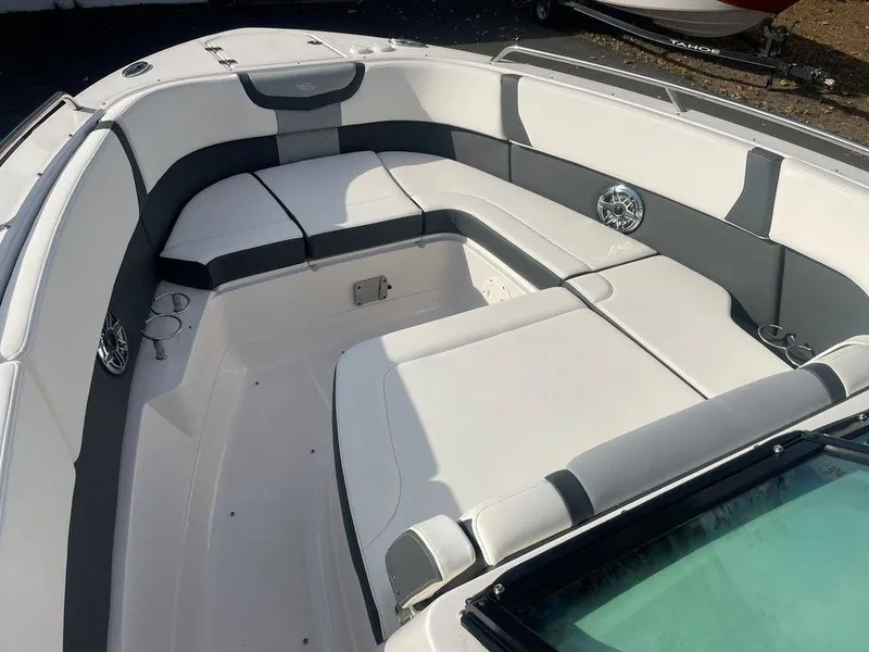 Slide: The Image of 2024 Chaparral 280 OSX boat interior with spacious seating and modern design. - 12