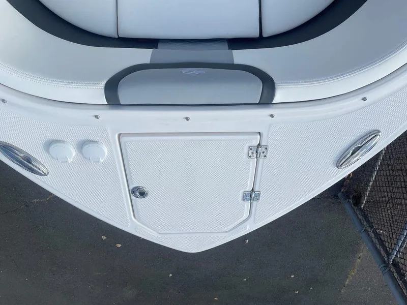 Slide: The Image of 2024 Chaparral 280 OSX boat bow with storage compartment and seating. - 14