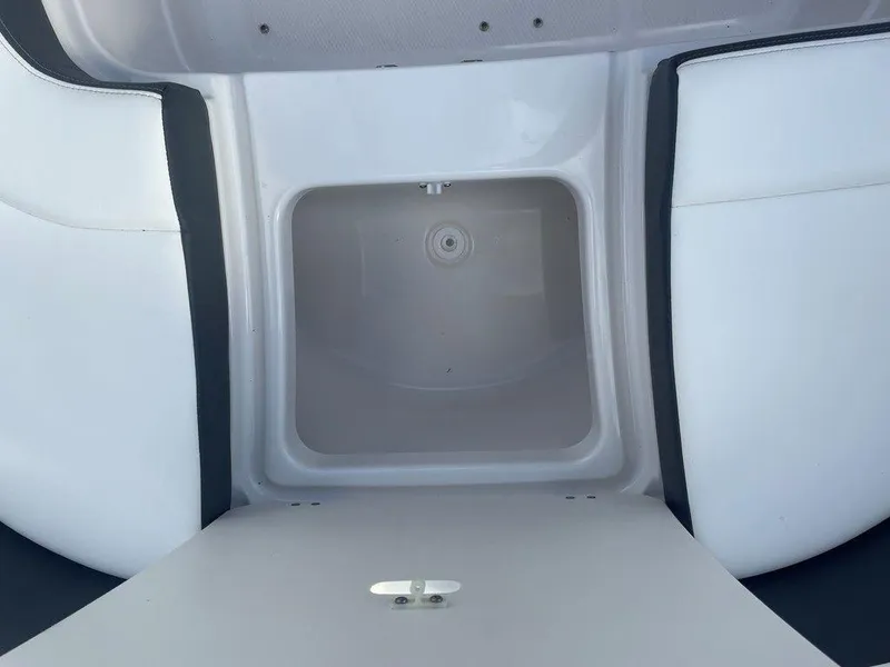 Slide: The Image of 2024 Chaparral 280 OSX boat storage compartment, open and empty. - 15