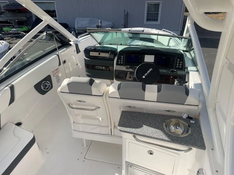 Slide: The Image of 2024 Chaparral 280 OSX boat interior with modern dashboard and seating. - 18