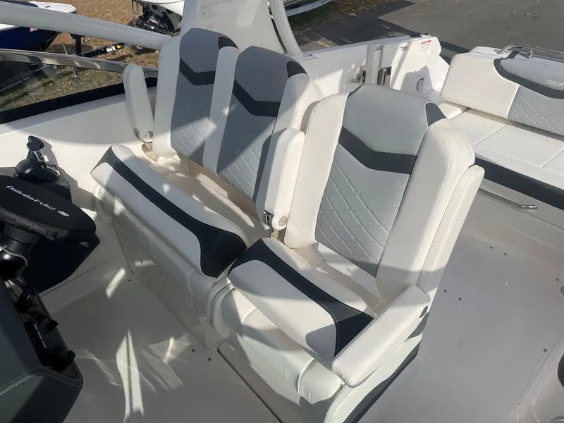 Slide: The Image of 2024 Chaparral 280 OSX boat interior with modern seating design. - 23