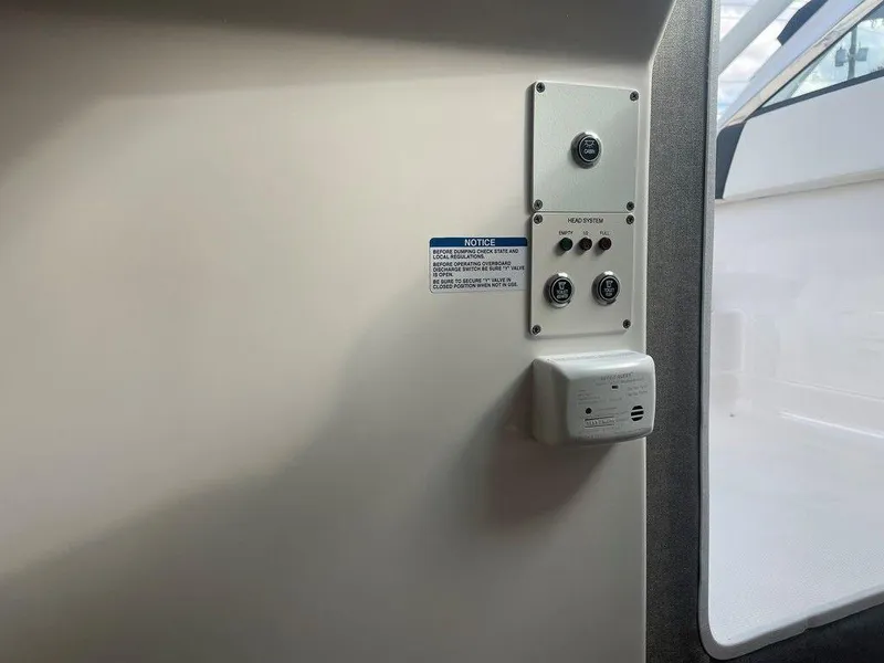 Slide: The Image of Control panel inside 2024 Chaparral 280 OSX boat cabin. - 27