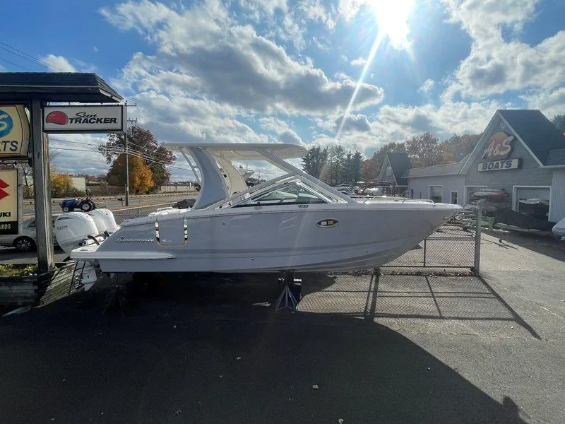Slide: The Image of 2024 Chaparral 280 OSX boat displayed outdoors under a sunny sky. - 3