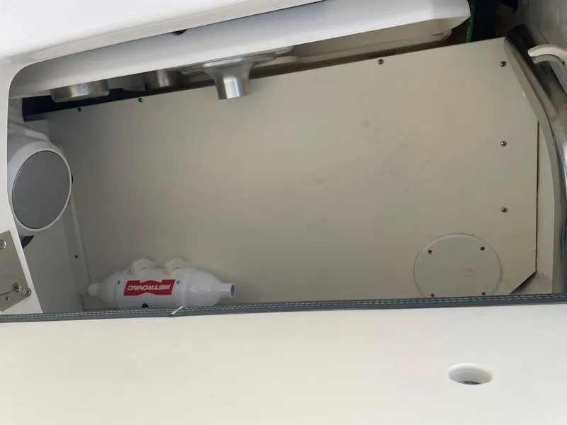 Slide: The Image of Storage compartment of 2024 Chaparral 280 OSX boat with marine equipment. - 36