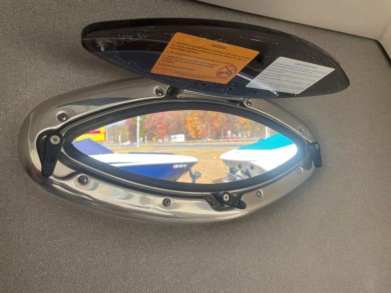 Slide: The Image of 2024 Chaparral 280 OSX boat window with open hatch, exterior view. - 42