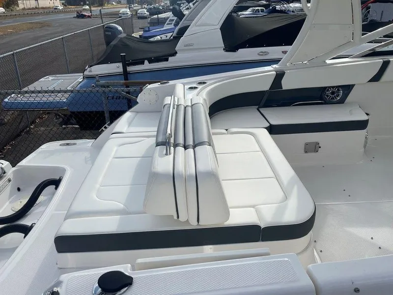 Slide: The Image of 2024 Chaparral 280 OSX boat interior with white seating and sleek design. - 45