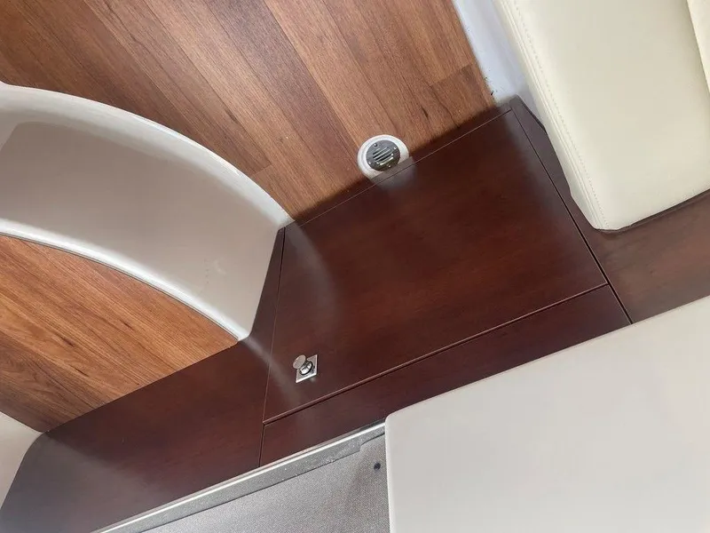 Slide: The Image of 2024 Chaparral 280 OSX interior with wood finish and seating. - 46