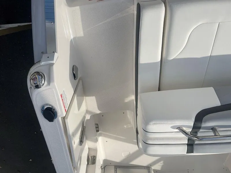 Slide: The Image of 2024 Chaparral 280 OSX boat interior with white seating and sleek design. - 48