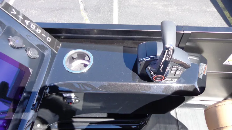 Slide: The Image of Control panel of the 2024 Viaggio Lago Z24U boat with throttle and cup holder. - 12