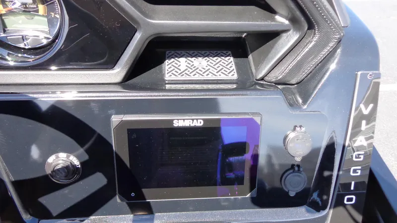 Slide: The Image of 2024 Viaggio Lago Z24U dashboard with Simrad display and controls. - 14
