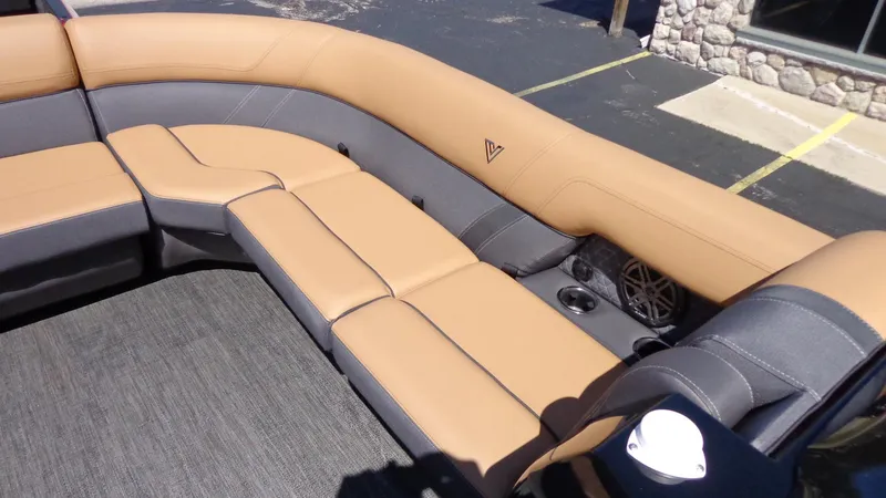 Slide: The Image of 2024 Viaggio Lago Z24U boat with tan and gray seating. - 16