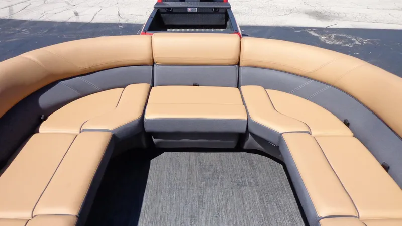 Slide: The Image of 2024 Viaggio Lago Z24U boat with tan and gray cushioned seating. - 18