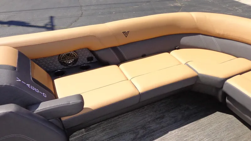 Slide: The Image of 2024 Viaggio Lago Z24U boat interior with tan and gray seating. - 21