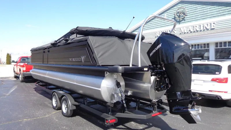 Slide: The Image of 2024 Viaggio Lago Z24U pontoon boat with Mercury outboard engine on trailer. - 29