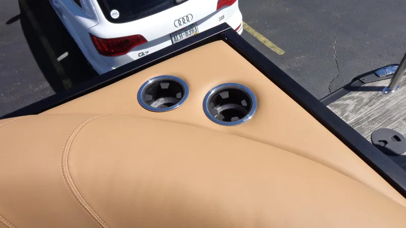 Slide: The Image of 2024 Viaggio Lago Z24U boat with tan leather seats and cup holders. - 6