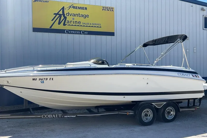 The Image of 1997 Cobalt 23 boat on trailer at marine dealership. - 0