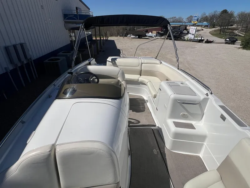 Slide: The Image of 1997 Cobalt 23 boat interior with seating and steering console. - 10
