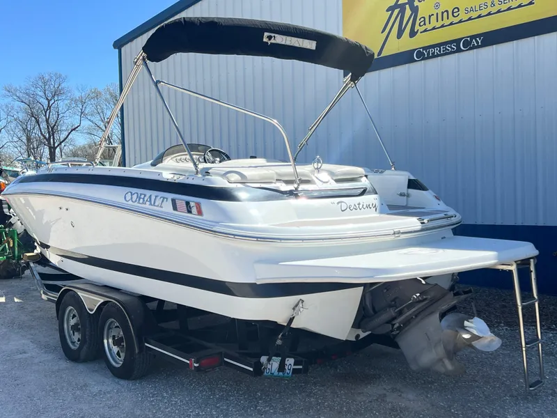 Slide: The Image of 1997 Cobalt 23 boat on trailer at marine sales and service. - 2