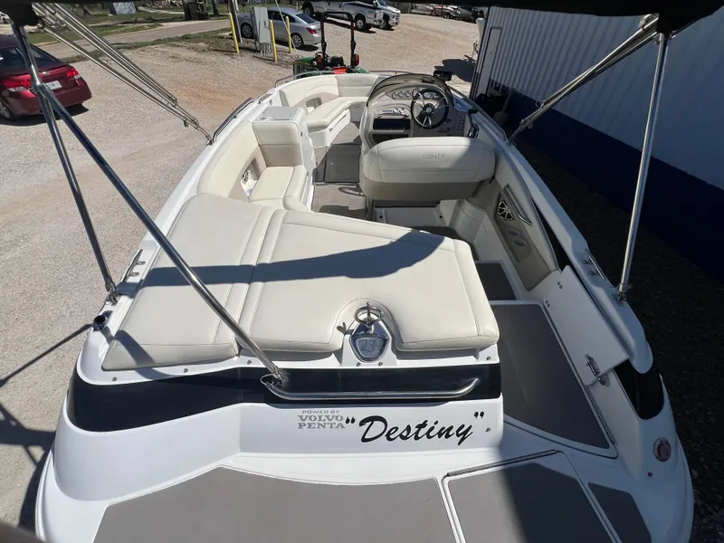 Slide: The Image of 1997 Cobalt 23 boat interior with white seating and Destiny name on the stern. - 5