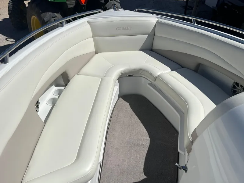 Slide: The Image of 1997 Cobalt 23 boat with white leather seating and carpeted floor. - 8