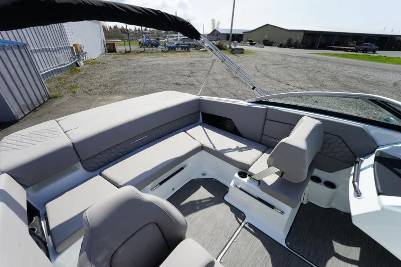 Slide: The Image of 2023 Four Winns H1 boat interior with spacious seating and modern design. - 11