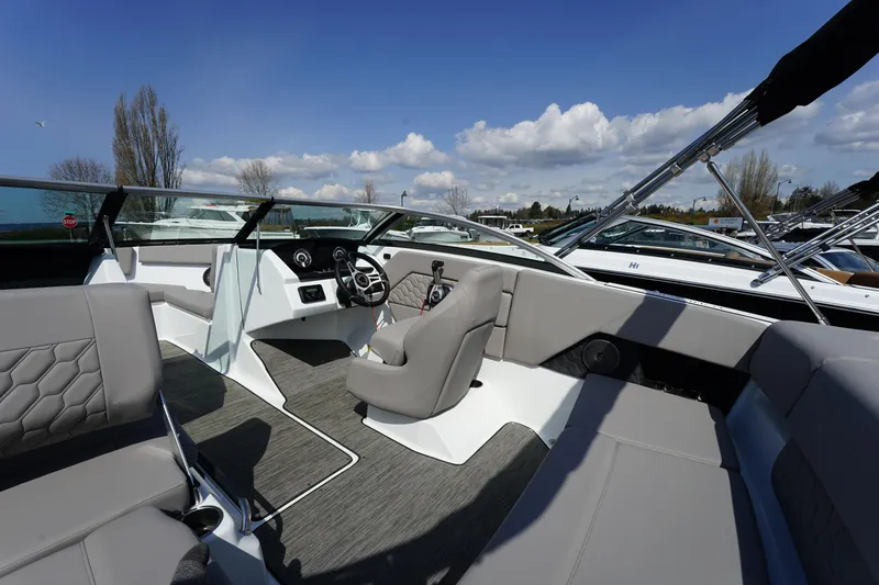 Slide: The Image of 2023 Four Winns H1 boat interior with modern seating and steering console. - 13