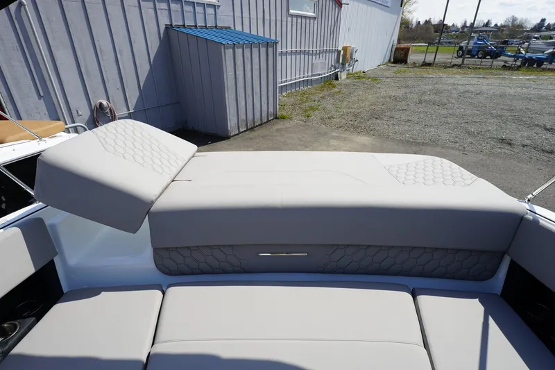 Slide: The Image of 2023 Four Winns H1 boat with cushioned seating and backrest. - 18