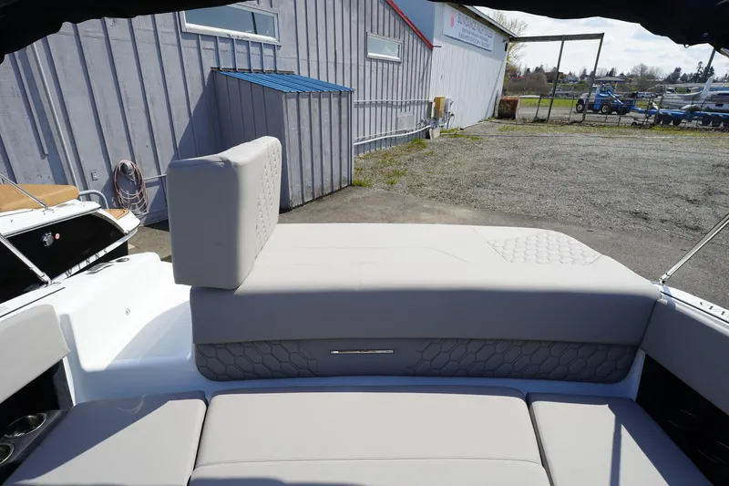 Slide: The Image of 2023 Four Winns H1 boat with spacious rear seating and modern design. - 19