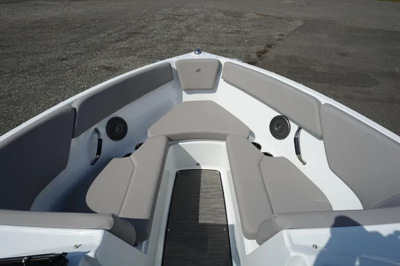 Slide: The Image of 2023 Four Winns H1 boat interior with gray seating and speakers. - 21