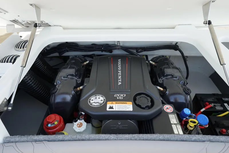 Slide: The Image of 2023 Four Winns H1 boat engine compartment with Volvo Penta 200 V6 engine. - 22