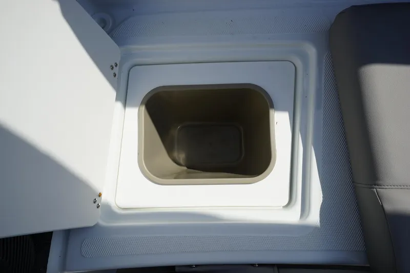 Slide: The Image of 2023 Four Winns H1 boat storage compartment with open lid. - 24
