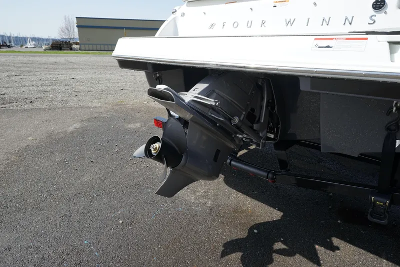 Slide: The Image of 2023 Four Winns H1 boat stern drive and propeller on a trailer. - 6