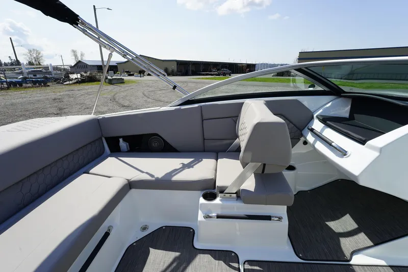 Slide: The Image of 2023 Four Winns H1 boat interior with gray seating and modern design. - 9