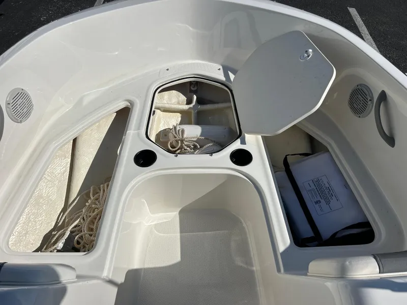 Slide: The Image of 2022 Bayliner Element E18 boat interior storage compartments. - 10