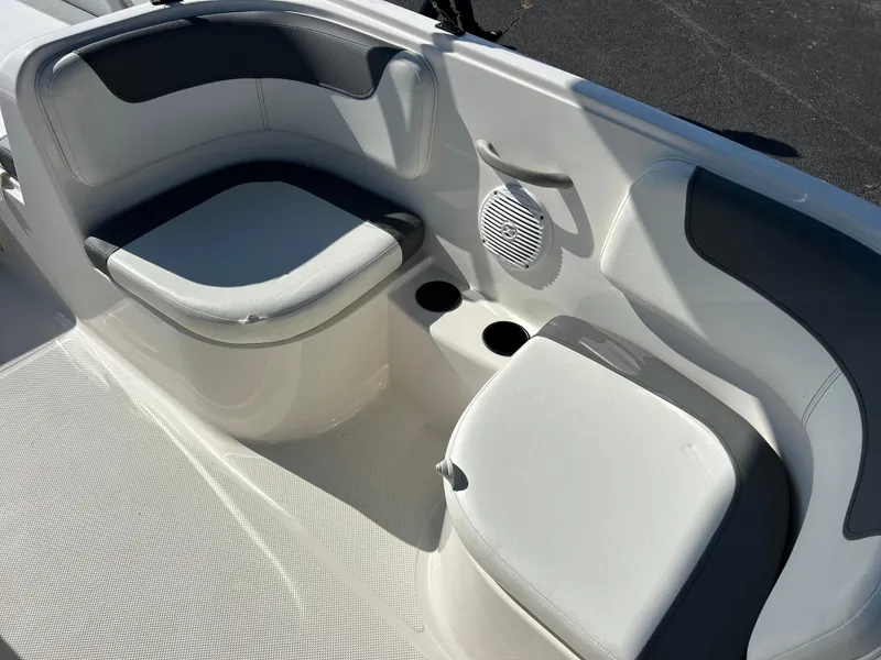 Slide: The Image of 2022 Bayliner Element E18 boat interior seating and cup holders. - 13