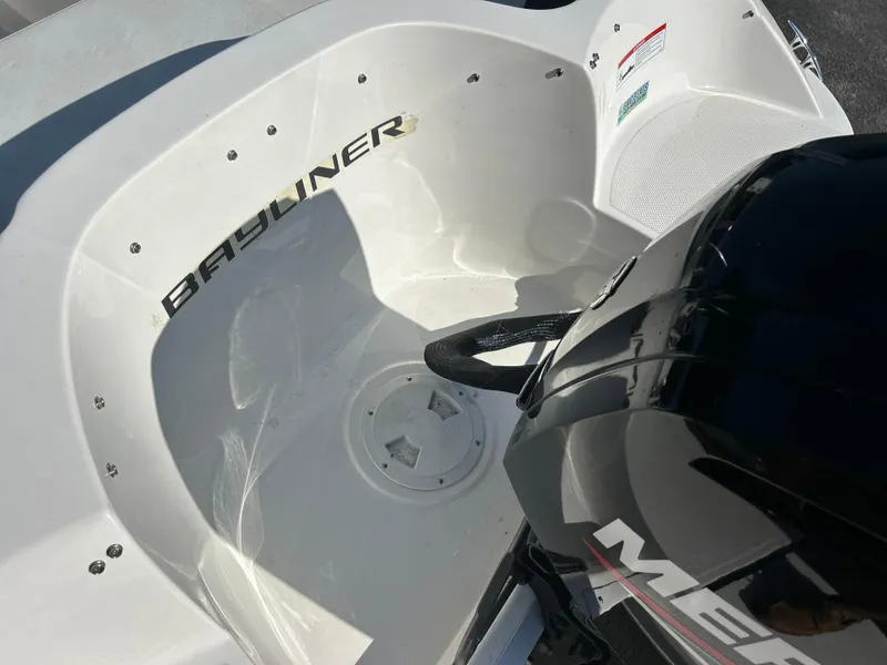 Slide: The Image of 2022 Bayliner Element E18 boat with Mercury engine, close-up view. - 19