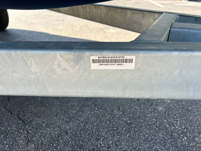 Slide: The Image of Close-up of a 2022 Bayliner Element E18 boat trailer with a barcode sticker. - 21