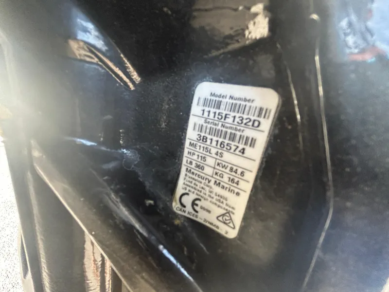 Slide: The Image of 2022 Bayliner Element E18 model and serial number label on boat engine. - 22