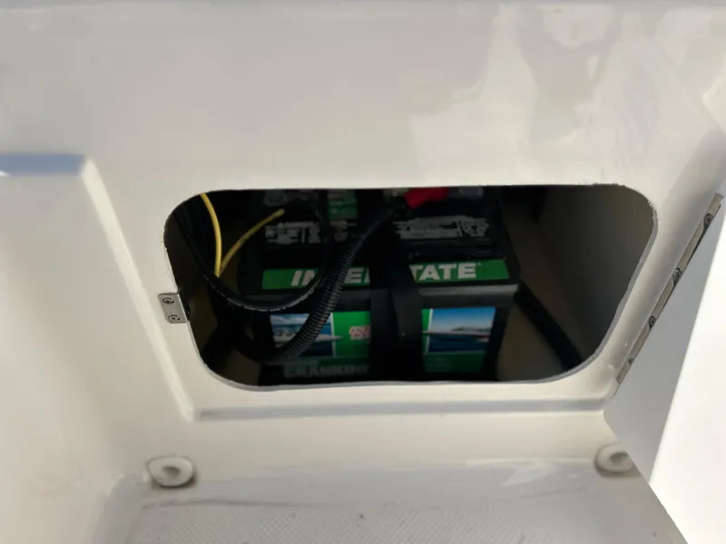Slide: The Image of Battery compartment of 2022 Bayliner Element E18 boat. - 25
