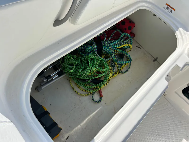 Slide: The Image of Storage compartment of 2022 Bayliner Element E18 boat with ropes and equipment. - 27