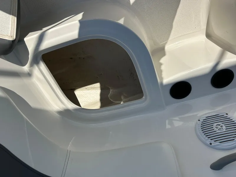 Slide: The Image of 2022 Bayliner Element E18 boat storage compartment and speaker. - 29