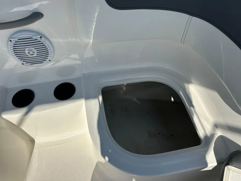 Slide: The Image of 2022 Bayliner Element E18 boat interior storage compartment and speaker. - 31