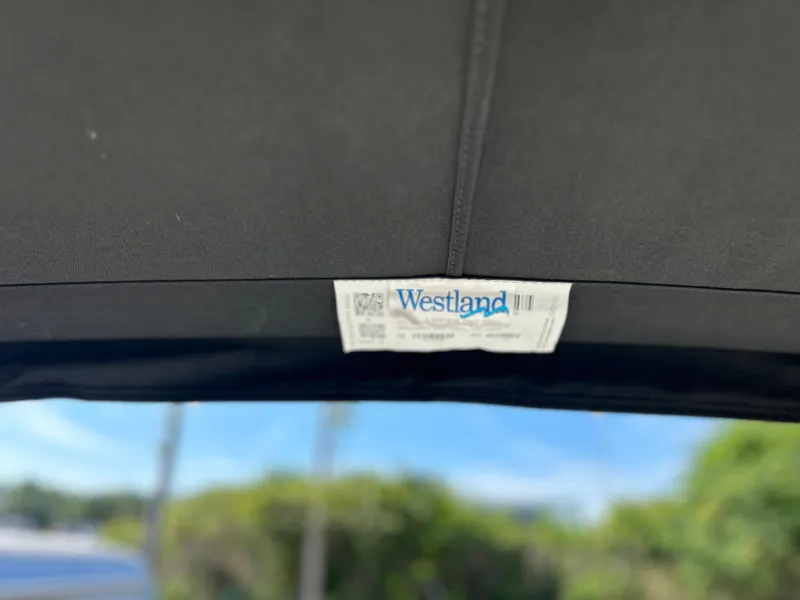 Slide: The Image of 2022 Bayliner Element E18 with Westland boat cover label. - 32