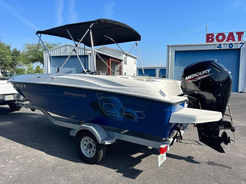 Slide: The Image of 2022 Bayliner Element E18 boat with Mercury outboard motor on trailer. - 5