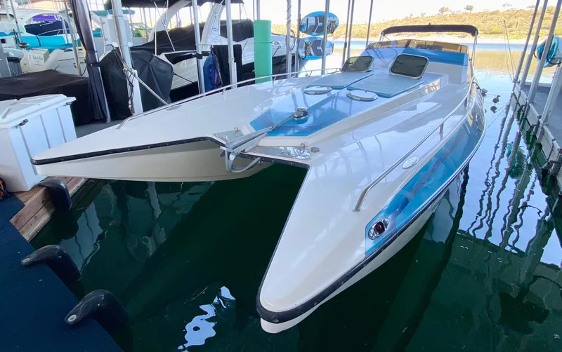The Image of 1988 Warlock 37 Cat Cruiser boat docked in marina. - 0