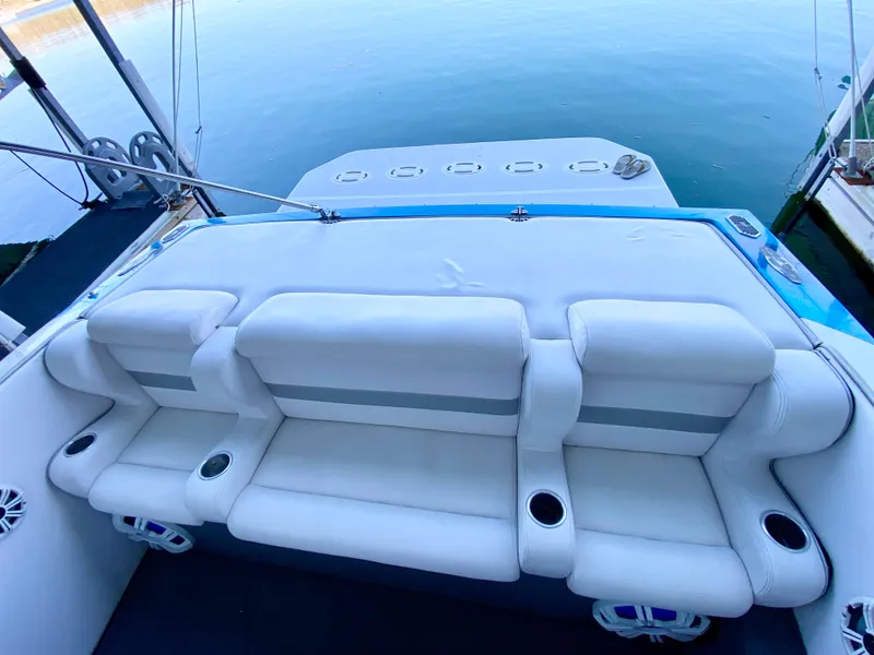 Slide: The Image of 1988 Warlock 37 Cat Cruiser with white leather seating and cup holders. - 13