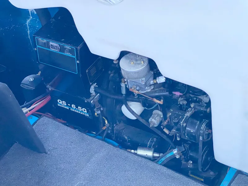 Slide: The Image of Engine compartment of a 1988 Warlock 37 Cat Cruiser boat with a QS-6.5G marine generator. - 20
