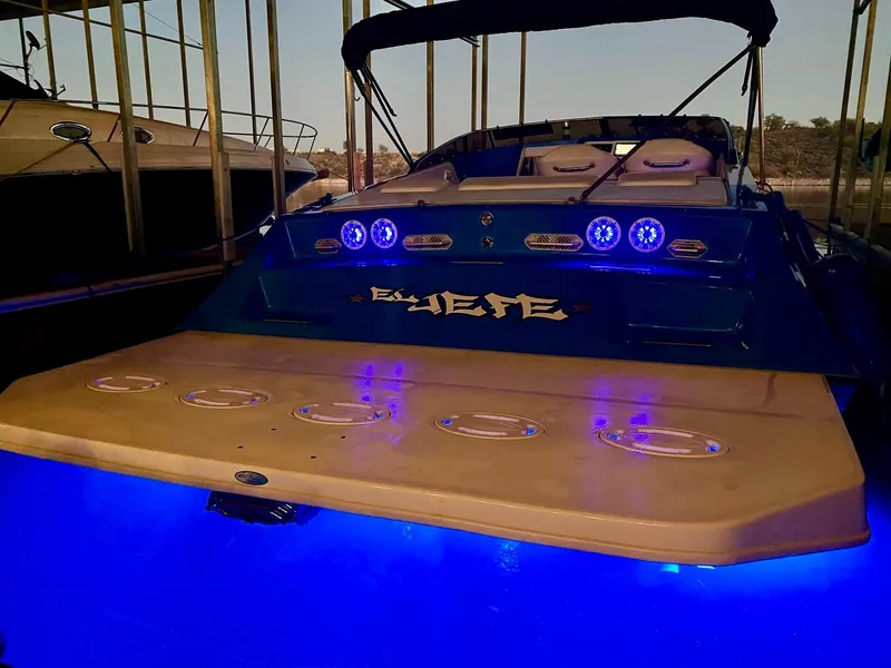 Slide: The Image of 1988 Warlock 37 Cat Cruiser with blue LED lights at dock. - 22