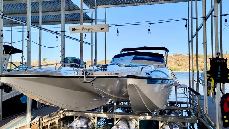 Slide: The Image of 1988 Warlock 37 Cat Cruiser docked in a marina. - 24